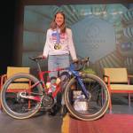Emilie Springer/ Homer News
Kristen Faulkner, 2024 Olympic gold medal cyclist, poses with her bike on the Homer Mariner Theatre stage on Friday Dec. 27, 2024, in Homer, Alaska.