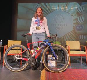 Emilie Springer/ Homer News
Kristen Faulkner, 2024 Olympic gold medal cyclist, poses with her bike on the Homer Mariner Theatre stage on Friday Dec. 27, 2024, in Homer, Alaska.