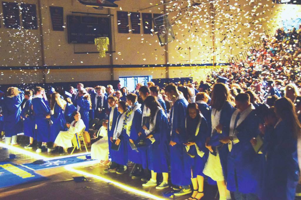 Homer High School class of 2024 rises at the end of the Tuesday evening commencement program before heading to the Commons to be welcomed by friends and family. Emilie Springer/ Homer News