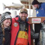 Chris Keithley, 2024 Homer Winter King Salmon Tournament champion, poses with his prize fish after the awards ceremony at the Deep Water Dock on the Spit in Homer, Alaska on Saturday, March 23, 2024. (Delcenia Cosman/Homer News)