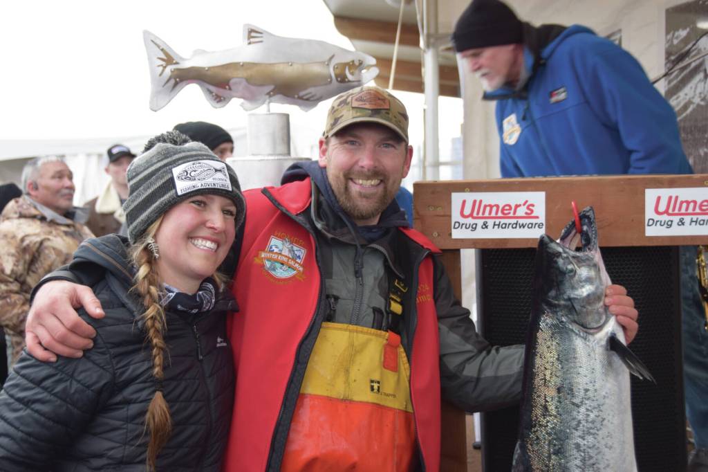 Chris Keithley, 2024 Homer Winter King Salmon Tournament champion, poses with his prize fish after the awards ceremony at the Deep Water Dock on the Spit in Homer, Alaska on Saturday, March 23, 2024. (Delcenia Cosman/Homer News)