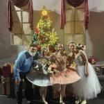 Ken Castner with Nutcracker senior dancers Natalia Sherwood, Tiya Martushev and Sofia Loboy in front of the Stahlbaum Christmas tree after last Sundays matinee performance. Emilie Springer/ Homer News