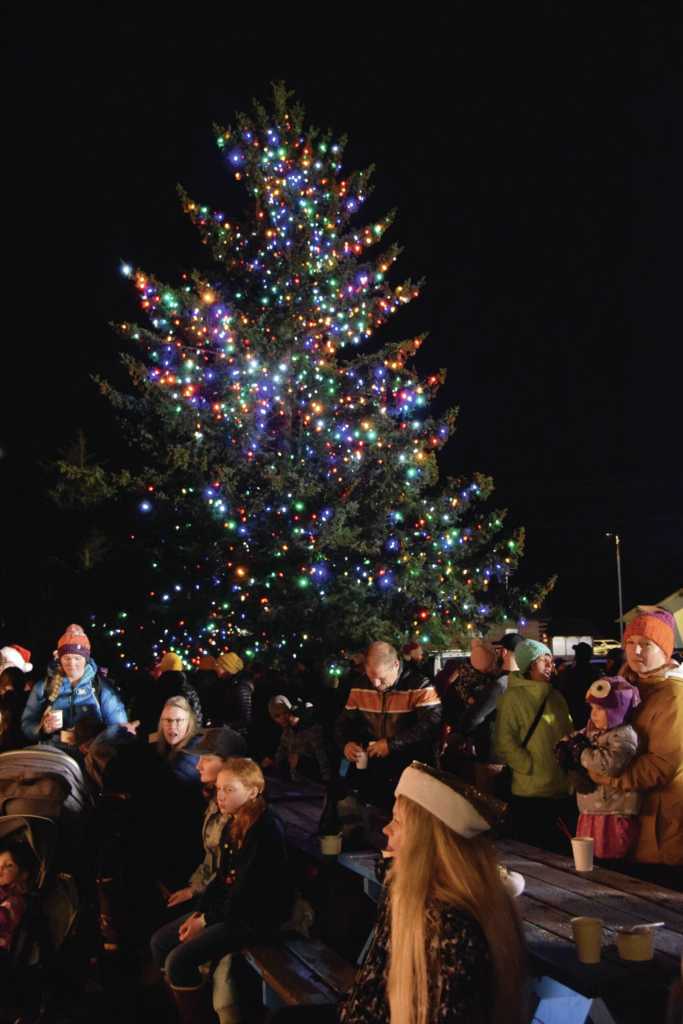 Families gather at the Homer Chamber of Commerce for their annual Christmas tree lighting ceremony on Thursday, Dec. 5, 2024, in Homer, Alaska. (Delcenia Cosman/Homer News)