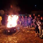 Anchor Point community members gather around a bonfire at the Virl Pa Haga VFW Post 10221 before the fireworks show on Dec. 31, 2024, in Anchor Point, Alaska. (Delcenia Cosman/Homer News)
