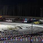 Racers round the track ahead of the start of the first race of the Kenai Peninsula Ice Racing season at Twin City Raceway in Kenai, Alaska, on Tuesday, Dec. 31, 2024. (Jake Dye/Peninsula Clarion)