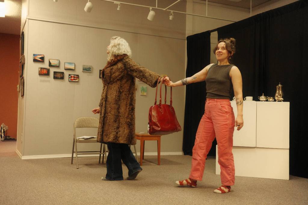 Christine Kulcheski as Hertha Ayrton and Katherine Brennan as Marie Curie rehearse The Half-Life of Marie Curie on Sunday, Jan. 12, 2025, at Homer Council on the Arts in Homer, Alaska, as part of HCOAs and Pier One Theatres collaborative exhibit, Women in Science. Photo courtesy of Jen Norton