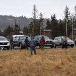 People gather in the parking lot near Lighthouse Fish & Chips on Tuesday, Jan. 21, 2025, in Homer, Alaska. The community was searching the area for a horse thats been missing since Sunday. (Chloe Pleznac/Homer News)