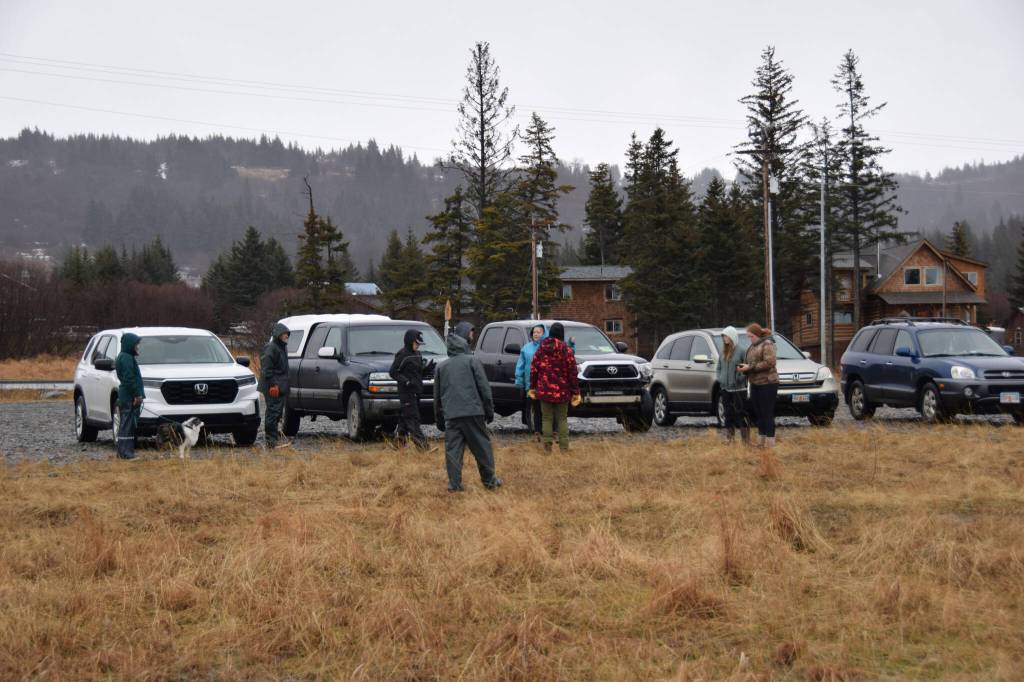 People gather in the parking lot near Lighthouse Fish & Chips on Tuesday, Jan. 21, 2025, in Homer, Alaska. The community was searching the area for a horse thats been missing since Sunday. (Chloe Pleznac/Homer News)