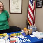 Ramona Taylor with the Alaska Housing Finance Corporation provides information on housing and public assistance to attendees of the Community Resource Connect event on Tuesday, Jan. 28, 2025, at the Virl Pa Haga VFW Post 10221 in Anchor Point, Alaska. (Delcenia Cosman/Homer News)