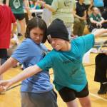 Athletes compete in the Dene stick pull during the Kahtnuhtana Hey Chiula Native Youth Olympics Invitational at Skyview Middle School near Soldotna, Alaska, on Sunday, Jan. 26, 2025. (Jake Dye/Peninsula Clarion)
