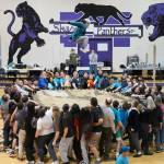 More than 50 people work together to perform a traditional blanket toss during the Kahtnuhtana Hey Chiula Native Youth Olympics Invitational at Skyview Middle School near Soldotna, Alaska, on Sunday, Jan. 26, 2025. (Jake Dye/Peninsula Clarion)