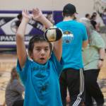 An athlete prepares to attempt the one-foot high kick during the Kahtnuhtana Hey Chiula Native Youth Olympics Invitational at Skyview Middle School near Soldotna, Alaska, on Sunday, Jan. 26, 2025. (Jake Dye/Peninsula Clarion)