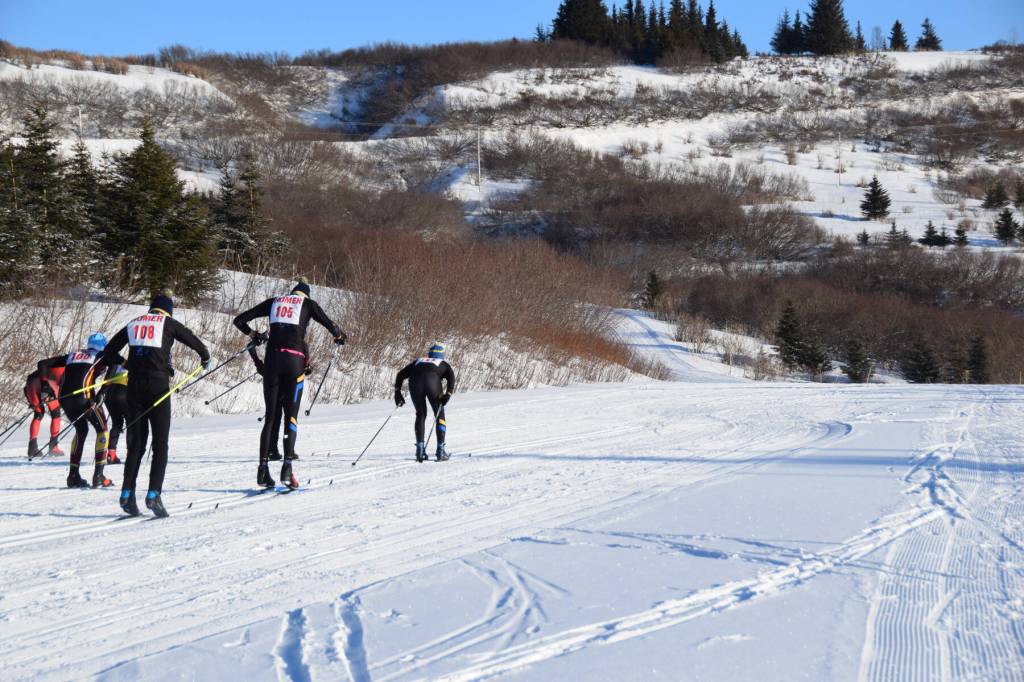 The varsity boys take off from the starting area at the Lookout Mountain Cross-Country Ski Trails on Ohlson Mountain on Thursday, Jan. 30, 2025. (Chloe Pleznac/Homer News)
