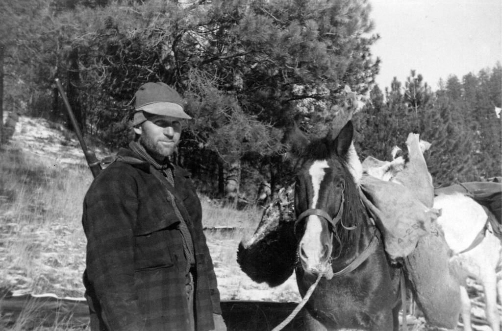 Poopdeck Platt, in western Montana circa 1946, packs out a deer after a successful day of hunting. (Photo courtesy of the Huebsch Family Collection)