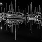 Harbor at Night, a photo by Andrew Tomey taken in the winter of 2021, showcases boats in the Homer Harbor and is one of several images on display in Tomeys solo exhibit at Kachemak Bay Recovery Connection in Homer, Alaska, through February 2025. Photo provided by Kachemak Bay Recover Connection