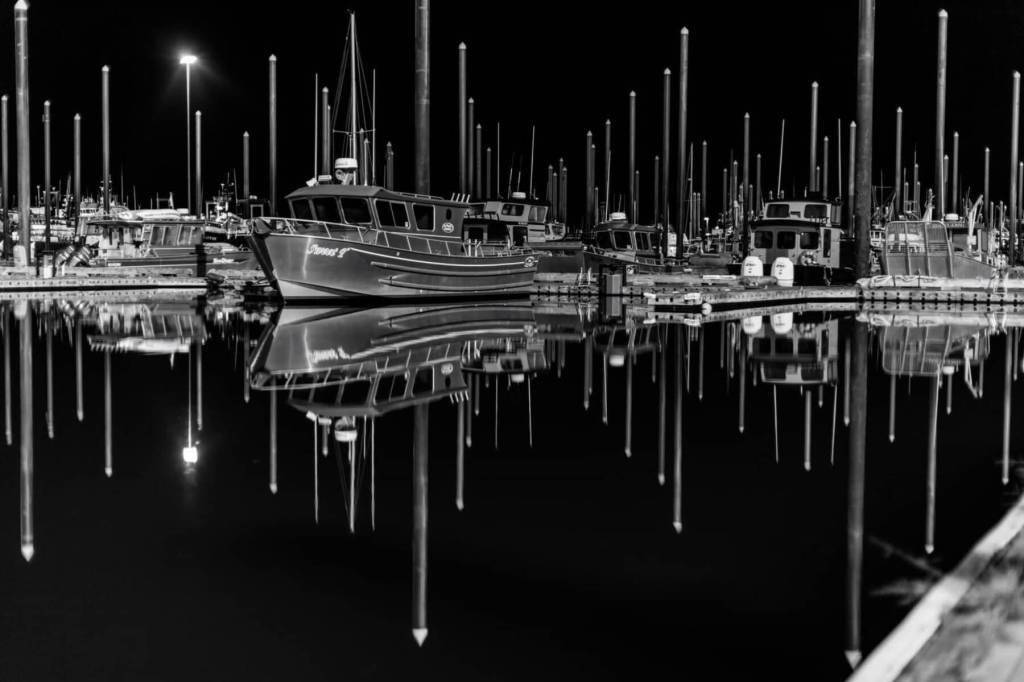 Harbor at Night, a photo by Andrew Tomey taken in the winter of 2021, showcases boats in the Homer Harbor and is one of several images on display in Tomeys solo exhibit at Kachemak Bay Recovery Connection in Homer, Alaska, through February 2025. Photo provided by Kachemak Bay Recover Connection