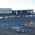 Debris and damage to the Glacier D restaurant is seen on Monday, Nov. 18, 2024, following a storm event that caused erosion damage to the Homer Spit on Saturday in Homer, Alaska. (Delcenia Cosman/Homer News)