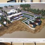 A schematic rendering of the southwest view of Doyon, Limiteds revised Lighthouse Village redevelopment design is on display during a special Planning Commission meeting on Wednesday, Oct. 16, 2024, in the Homer City Hall Cowles Council Chambers in Homer, Alaska. (Delcenia Cosman/Homer News)