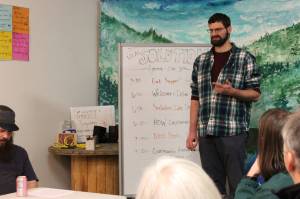 Cook Inletkeeper Energy Policy Analyst Ben Boettger presents information about retrofitting homes to be more energy efficient at the Cook Inletkeeper Community Action Studio on Tuesday, Dec. 5, 2023, in Soldotna, Alaska. (Ashlyn OHara/Peninsula Clarion)