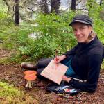 Artist Kim McNett draws mushrooms during a mushroom journaling and identification retreat she hosted at Seldovia Bay in Alaska in the fall of 2024. Photo provided by Kim McNett