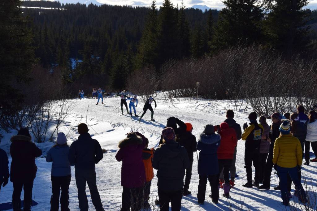 Family members, coaches, and friends cheer on the Varsity girls as they race up a hill on Saturday, Feb. 8, 2025 at the Lookout Mountain XCS Trails. (Chloe Pleznac/Homer News)