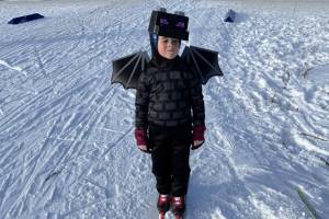 One half of the best pair prize-winning duo - a skiing ender dragon - stands for a photo on Sunday, Feb. 9 during the annual Ski for Women fundraiser at the Lookout Mountain XCS Trails on Ohlson Mountain. (Chloe Pleznac/Homer News)