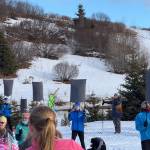 Homer Middle School skiers line up for their performance of Mikaela Shiffrin in the Giant Slalom during the annual Ski for Women fundraiser at the Lookout Mountain XCS Trails on Ohlson Mountain. (Chloe Pleznac/Homer News)