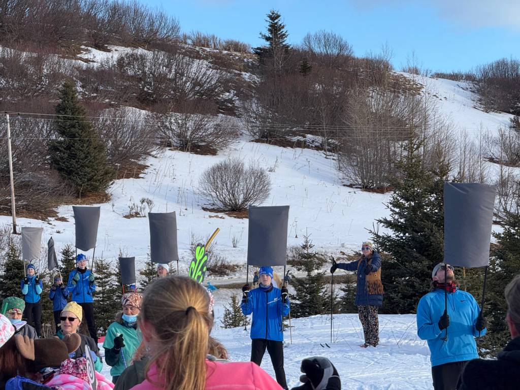 Homer Middle School skiers line up for their performance of Mikaela Shiffrin in the Giant Slalom during the annual Ski for Women fundraiser at the Lookout Mountain XCS Trails on Ohlson Mountain. (Chloe Pleznac/Homer News)