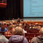 Kenai Peninsula Borough School District Finance Director Elizabeth Hayes takes questions during the Homer budget development meeting on Tuesday, Feb. 11, 2025, in the Mariner Theatre at Homer High School in Homer, Alaska. (Chloe Pleznac/Homer News)