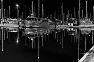 Harbor at Night, a photograph taken by Andrew Tomey in the winter of 2021, showcases boats in the Homer Harbor and is one of several images on display in his solo exhibit through February at Kachemak Bay Recovery Connection in Homer, Alaska. Photo provided by Andrew Tomey