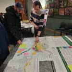 Delcenia Cosman/Homer News
Attendees of the open house event for the draft 2035 comprehensive plan evaluate potential land use maps on Tuesday, Feb. 11<ins>, 2025,</ins> at the Alaska Maritime National Wildlife Refuge Visitor Center<ins> in Homer, Alaska</ins>.
