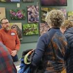 City of Homer Planning Director Ryan Foster (left) answers questions from community members about the draft 2035 comprehensive plan during an open house event on Tuesday, Feb. 11<ins>, 2025,</ins> at the Alaska Maritime National Wildlife Refuge Visitor Center<ins> in Homer, Alaska</ins>. (Delcenia Cosman/Homer News)