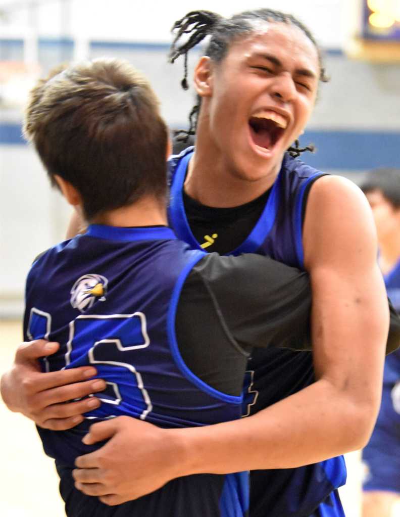 Marcarius Evans of Nanwalek celebrates a victory over Cook Inlet Academy on Saturday, February 15, 2025, at Cook Inlet Academy just outside of Soldotna, Alaska. (Photo by Jeff Helminiak/Peninsula Clarion)