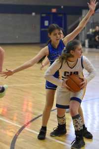 Cook Inlet Academys Serenity Plate holds the ball in front of Nanwaleks Alyson Seville on Saturday, February 15, 2025, at Cook Inlet Academy just outside of Soldotna, Alaska. (Photo by Jeff Helminiak/Peninsula Clarion)