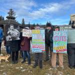 Community members protest executive government overreach and the ongoing drastic federal job cuts on Monday, Feb. 17, 2025, at WKFL Park in Homer, Alaska. Photo by Christina Whiting