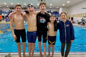 The Kachemak Swim Club team poses for a picture at the Alaska Swimming Age Group Championships on Feb. 14, 2025 in Fairbanks, Alaska. (Photo courtesy of Eric Sundheim)