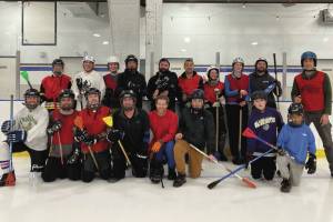 Homer broomball players pose on Dec. 7, 2024 at Kevin Bell Arena. Broomball has been an active, accessible Homer community sport for years. If youre interested in seeing it played, come out this weekend and support your local players or give it a swing yourself and hop on the ice! (Chloe Pleznac/Homer News)