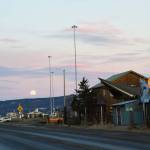 A full moon rises over the mountains, seen from the Homer Spit on Tuesday, Feb. 11, 2025, in Homer, Alaska. (Chloe Pleznac/Homer News)