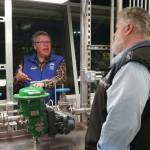 Professor of Process Technology Jeffrey Laube explains equipment to Kachemak Bay Campus Director Brian Partridge at a showcase of Kenai Peninsula Colleges career and technical education programs in the colleges Career and Technical Center in Soldotna on Thursday, Feb. 20. (Jake Dye/Peninsula Clarion)