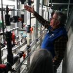Professor of Process Technology Jeffrey Laube explains equipment at a showcase of Kenai Peninsula Colleges career and technical education programs in the colleges Career and Technical Center in Soldotna, Alaska, on Thursday, Feb. 20, 2025. (Jake Dye/Peninsula Clarion)