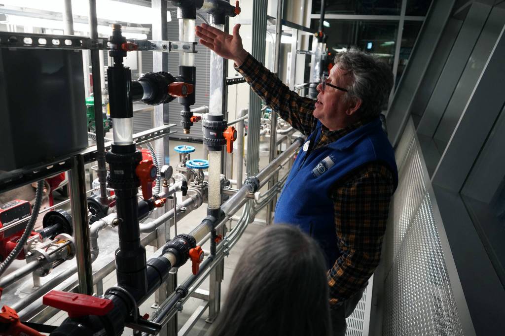 Professor of Process Technology Jeffrey Laube explains equipment at a showcase of Kenai Peninsula Colleges career and technical education programs in the colleges Career and Technical Center in Soldotna, Alaska, on Thursday, Feb. 20, 2025. (Jake Dye/Peninsula Clarion)