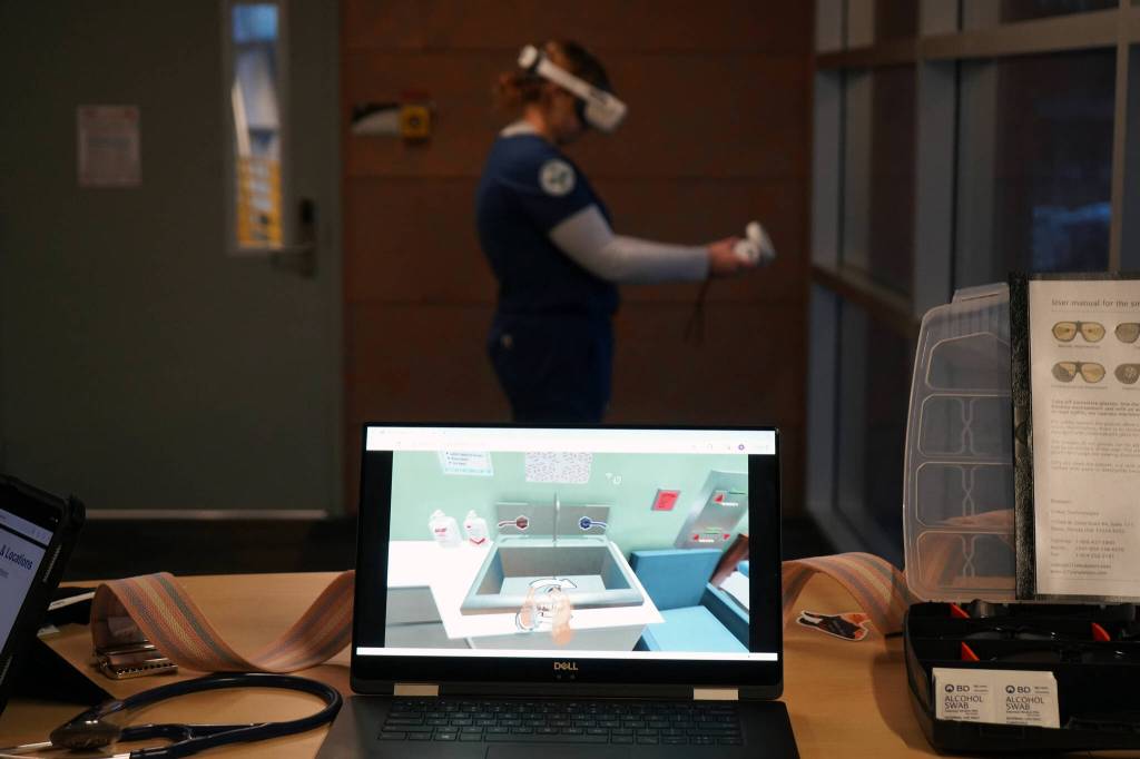 A student in Kenai Peninsula Colleges certified nursing assistant program participates in a Virtual Reality Nursing Assistant training at a showcase of KPCs career and technical education programs in the colleges Career and Technical Center in Soldotna, Alaska, on Thursday, Feb. 20, 2025. (Jake Dye/Peninsula Clarion)