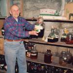 Photo courtesy of Ken Moore
Poopdeck holds up a sample of his many wine varieties.