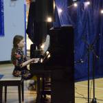 Juniper Goodman performs Taylor Swifts Love Story on the piano during the Cabin Fever Variety Show on Thursday, Feb. 27, 2025, in the Chapman School gym as part of the 2025 Snow Rondi in Anchor Point, Alaska. (Delcenia Cosman/Homer News)