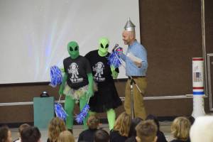 Principal Sean Campbell addresses the friendly aliens as they attempt to communicate despite their language barriers at Paul Banks Elementary School on Feb. 28, 2025. (Chloe Pleznac/Homer News)