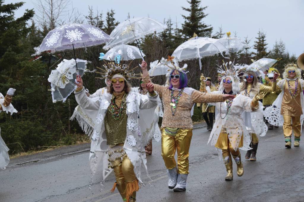 Members of the Krewe of Gambrinus dance down Milo Fritz Road to Walking on Sunshine during the Snow Rondi parade on Saturday<ins>, March 1, 2025,</ins> in Anchor Point<ins>, Alaska</ins>.