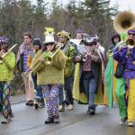 Musicians for the Krewe of Gambrinus play Walking on Sunshine as they march in the Snow Rondi parade on Saturday, March 1<ins>, 2025,</ins> in Anchor Point<ins>, Alaska</ins>.