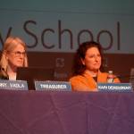 Penny Vadla and Assistant Superintendent Kari Dendurent listen to a presentation on proposed school closures during a meeting of the Kenai Peninsula Borough School Districts Board of Education in Homer, Alaska, on Monday, March 3, 2025. (Jake Dye/Peninsula Clarion)