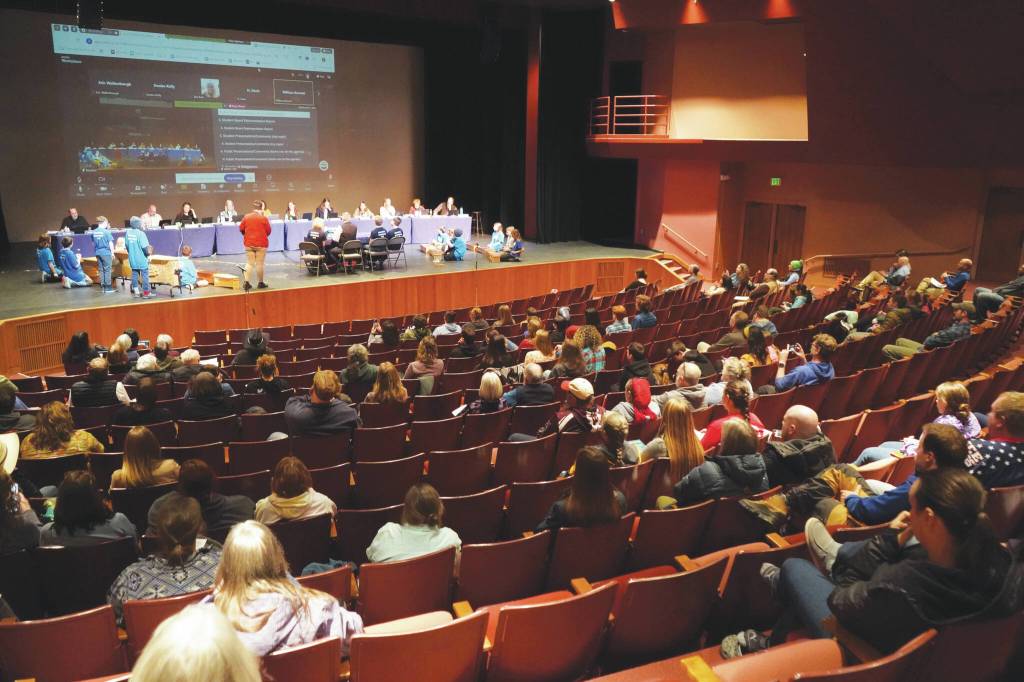 Jake Dye/Peninsula Clarion
Around 100 people fill seats during a meeting of the Kenai Peninsula Borough School Districts Board of Education in Homer on Monday.
