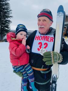 John Miles and Orin Buckelew pose for a photograph on Saturday, March 5, 2025 at the Lookout Mountain XC Ski Trails on Ohlson Mountain. Miles was the oldest to ski the 3km with a time of 33:04. Buckelew was the youngest, at 2, with a time of 21:20 in a chariot assist. (Photo courtesy of Jessie Goodrich)